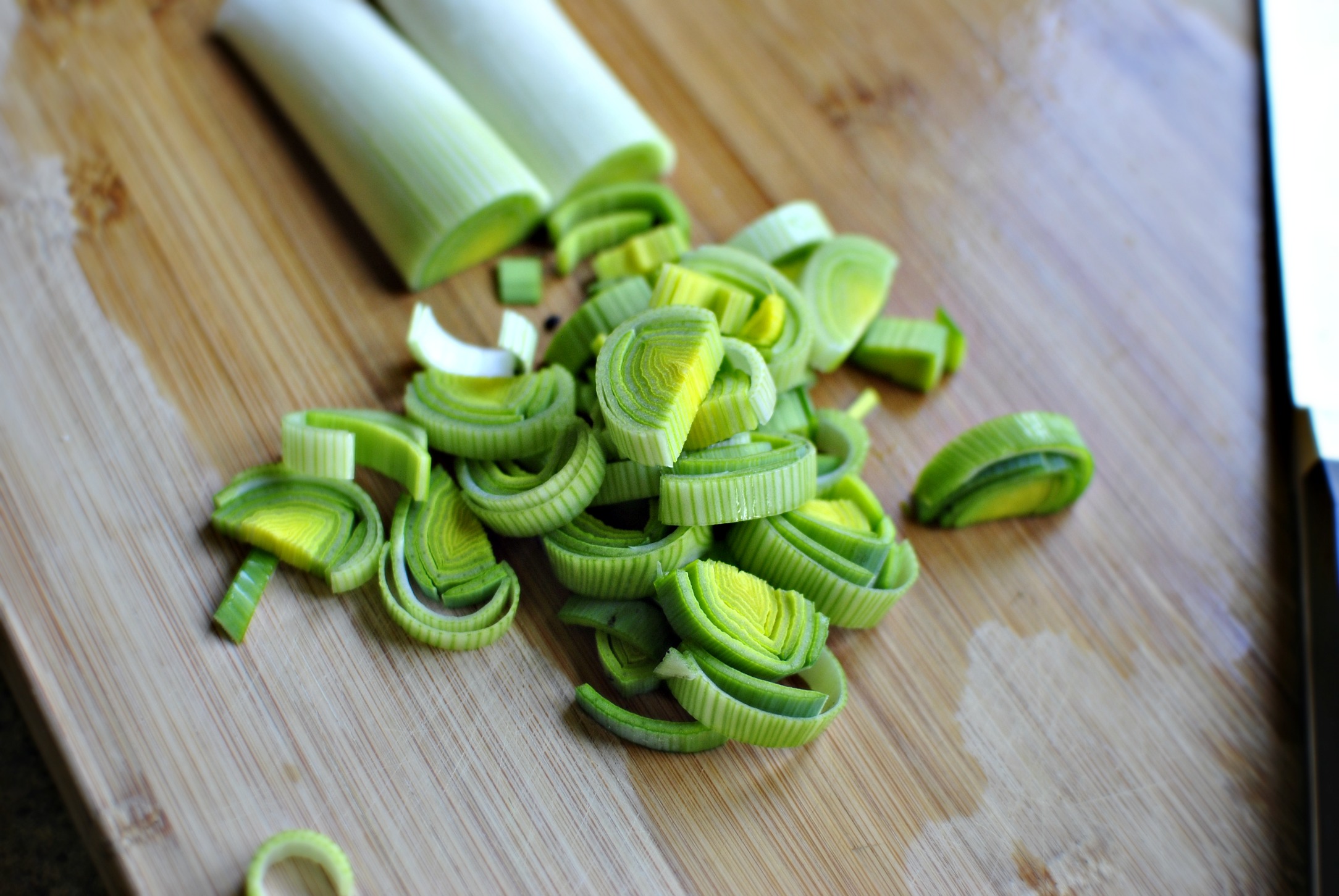 Simply Scratch trim, halve and slice two leeks Simply Scratch