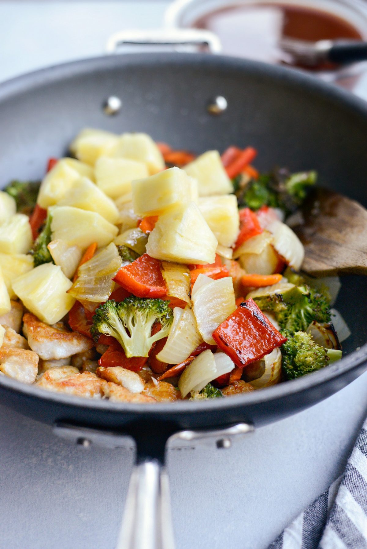 roasted vegetable and fresh pineapple added to pan with chicken.