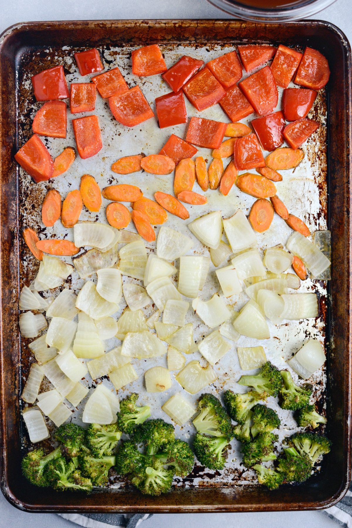 chopped red bell pepper, slice carrots, chopped onions and broccoli florets roasted