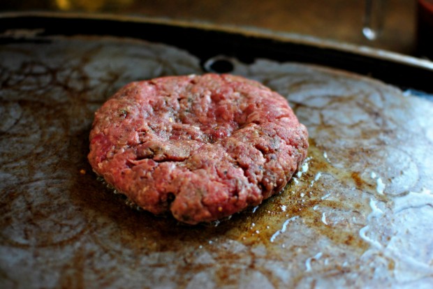 Griddled Steak Burgers with Jarlsberg + Sautéed Onions season side down and indent