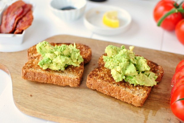 Bacon, Tomato + Avocado Smashed Toast l www.SimplyScratch.com ingredients spoon on avocado