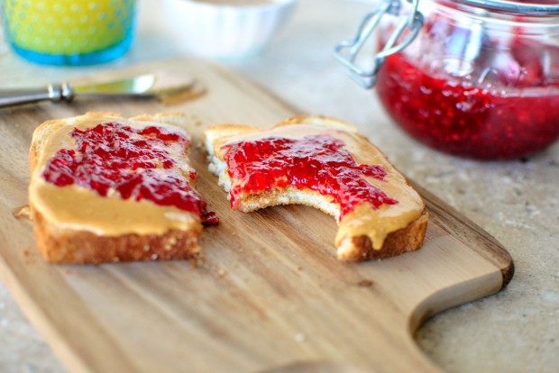 Homemade Honey Roasted Peanut Butter and Skillet Raspberry Jam Toast l www.SimplyScratch.com bite