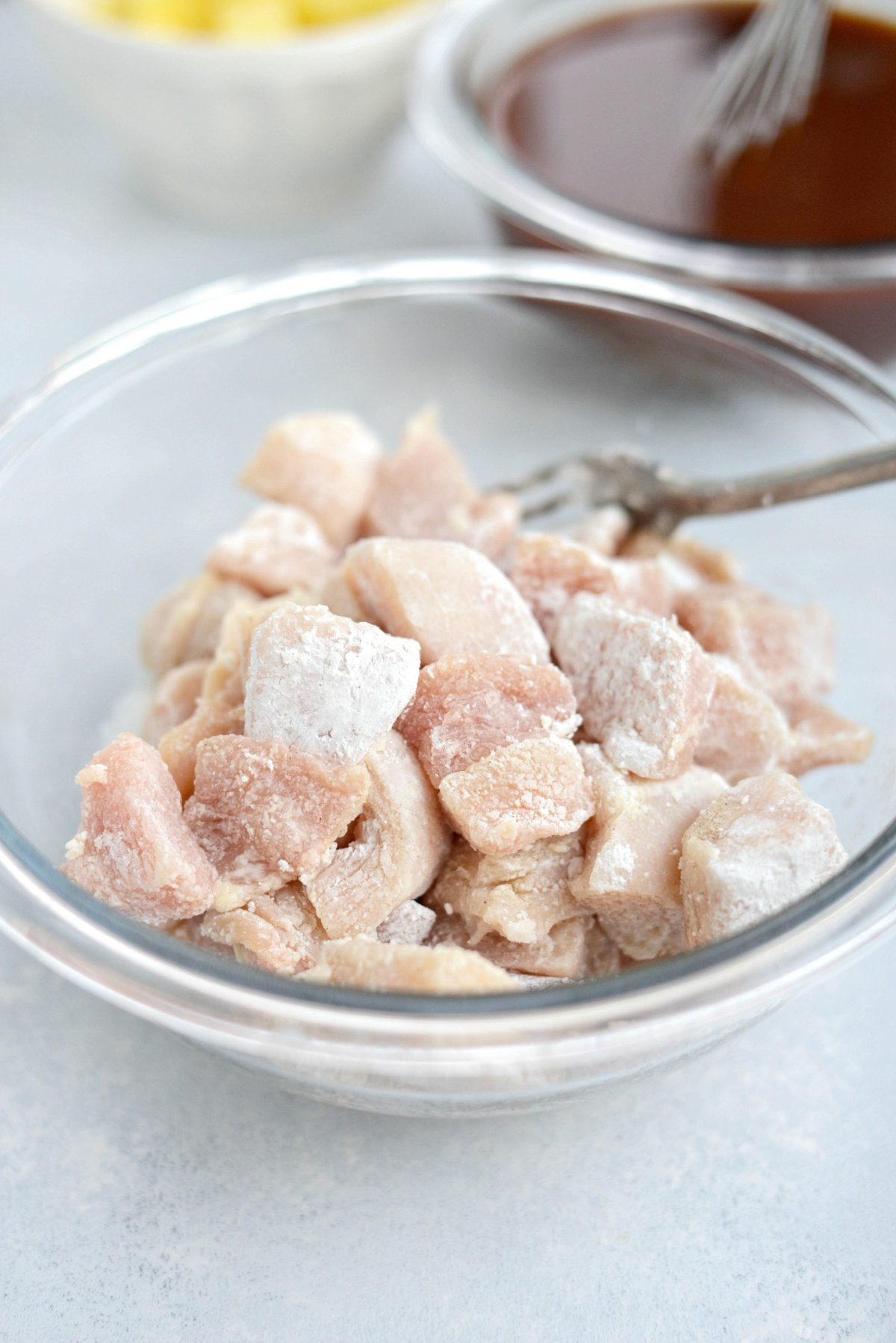 diced chicken tossed and coated with cornstarch and white pepper