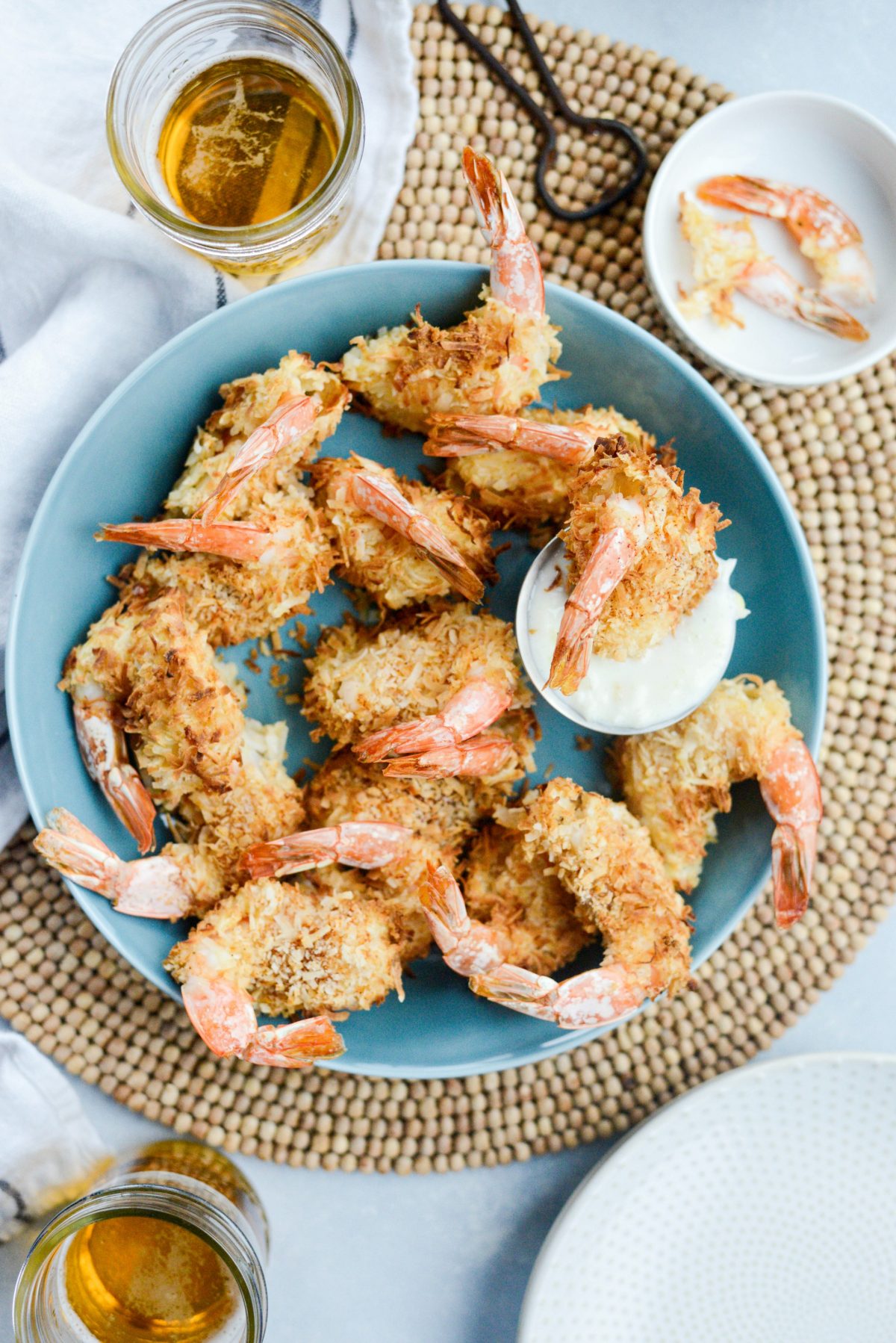 Air-Fryer Coconut Shrimp with Pineapple Coconut Yogurt Dip in a shallow blue bowl