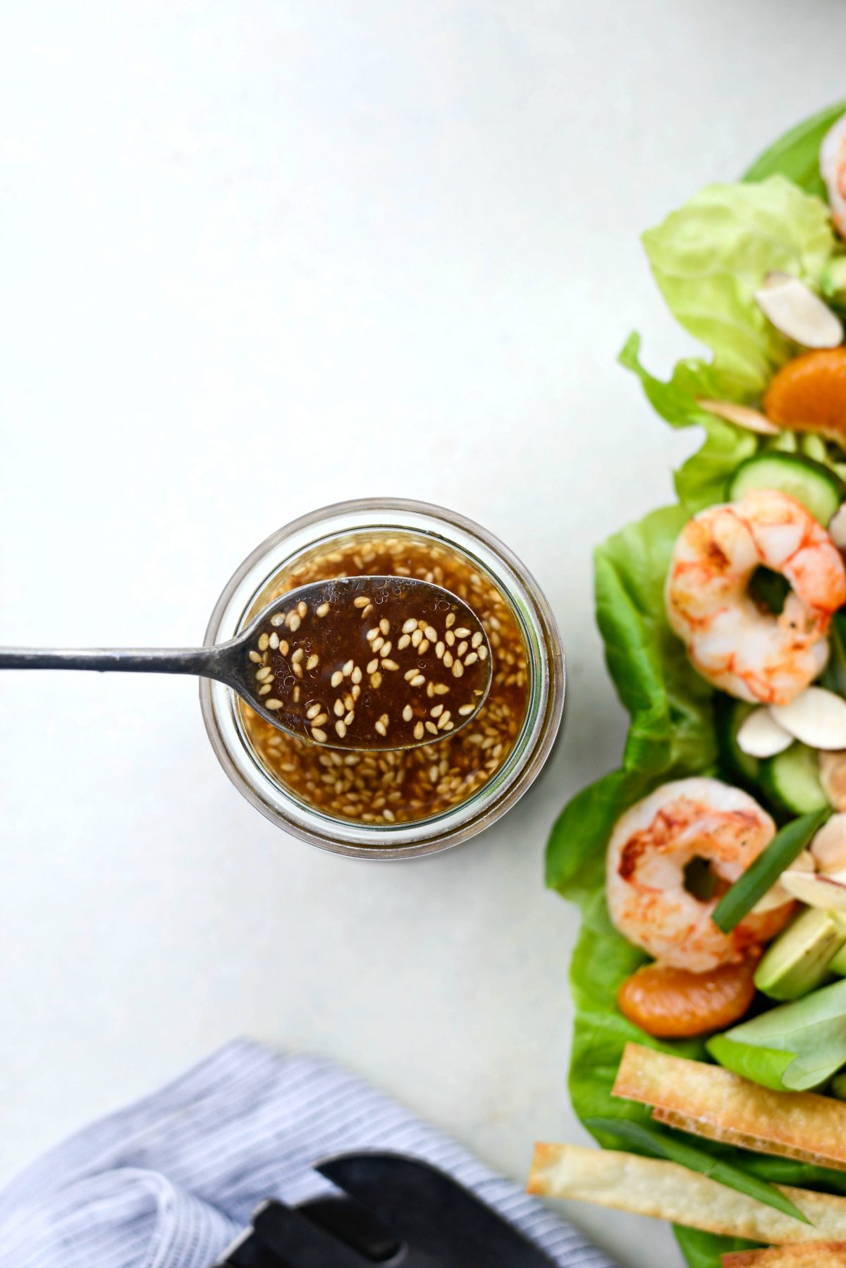 Grilled Asian Shrimp Salad with Crispy Wontons l SimplyScratch.com #shrimp #asian #salad #crispy #wonton #mandarin #oranges #toastedsesame #dressing #avocado