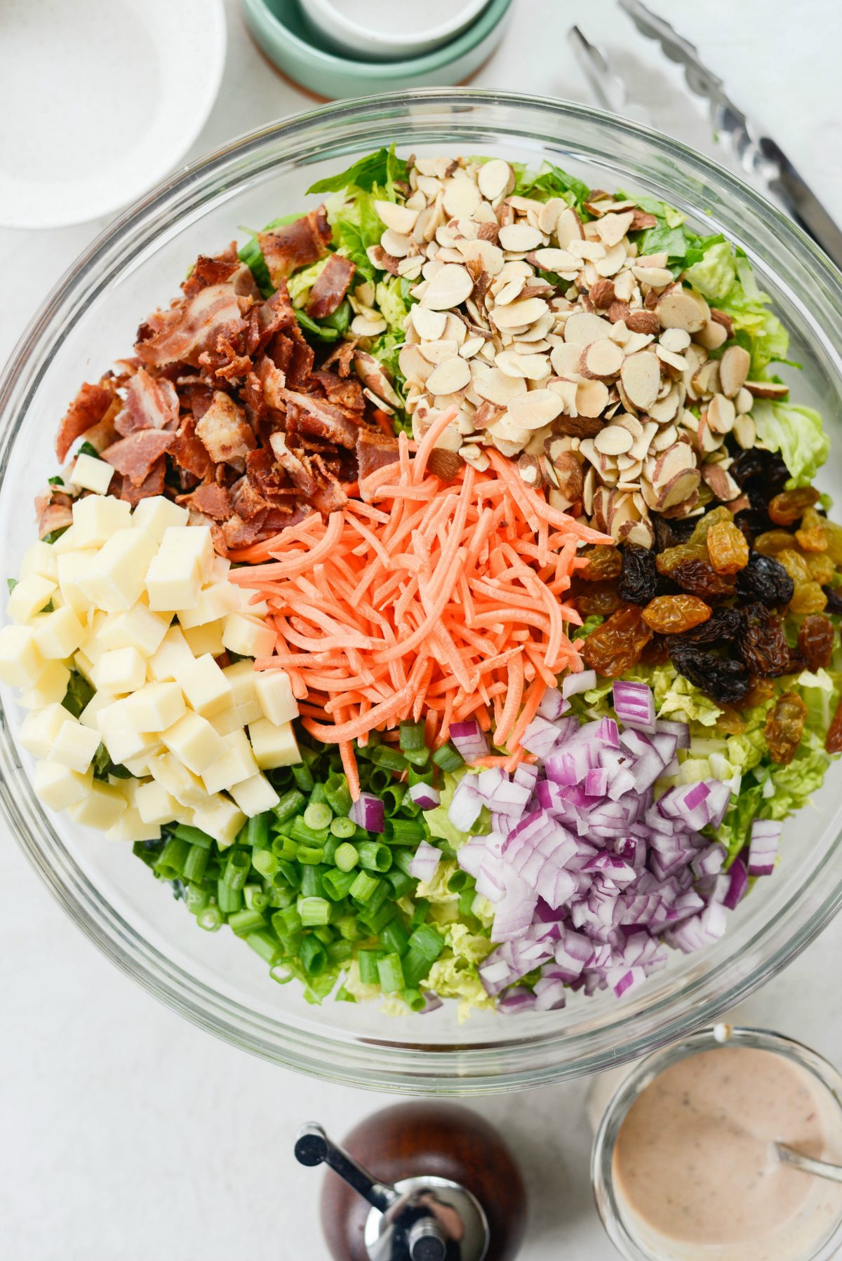 Chopped salad with sections of toppings.