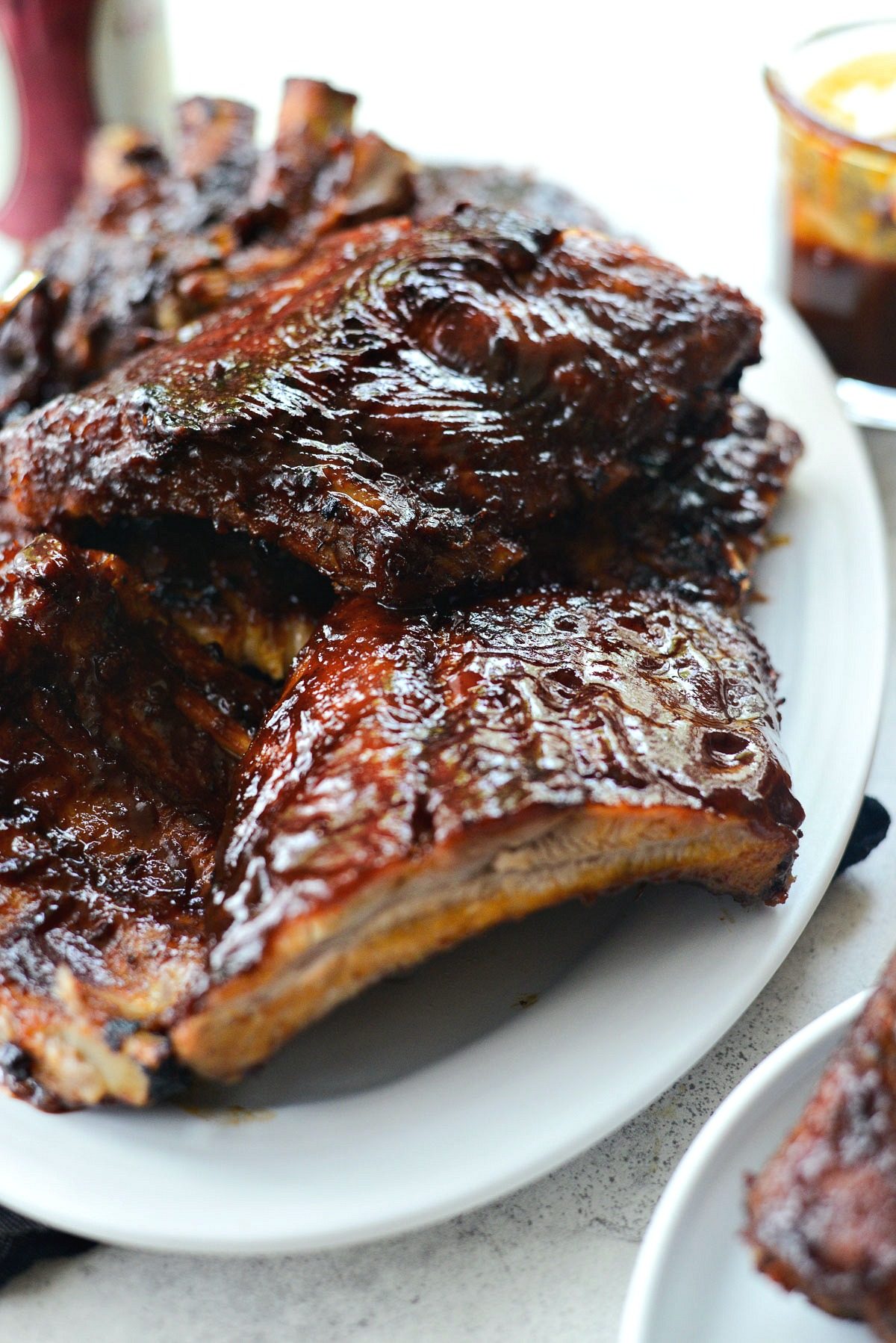 Easy BBQ Baby Back Ribs l SimplyScratch.com #easyrecipe #griling #BBQ #babybackribs #ribs #ovenbaked #grilled #homemade #sauce 