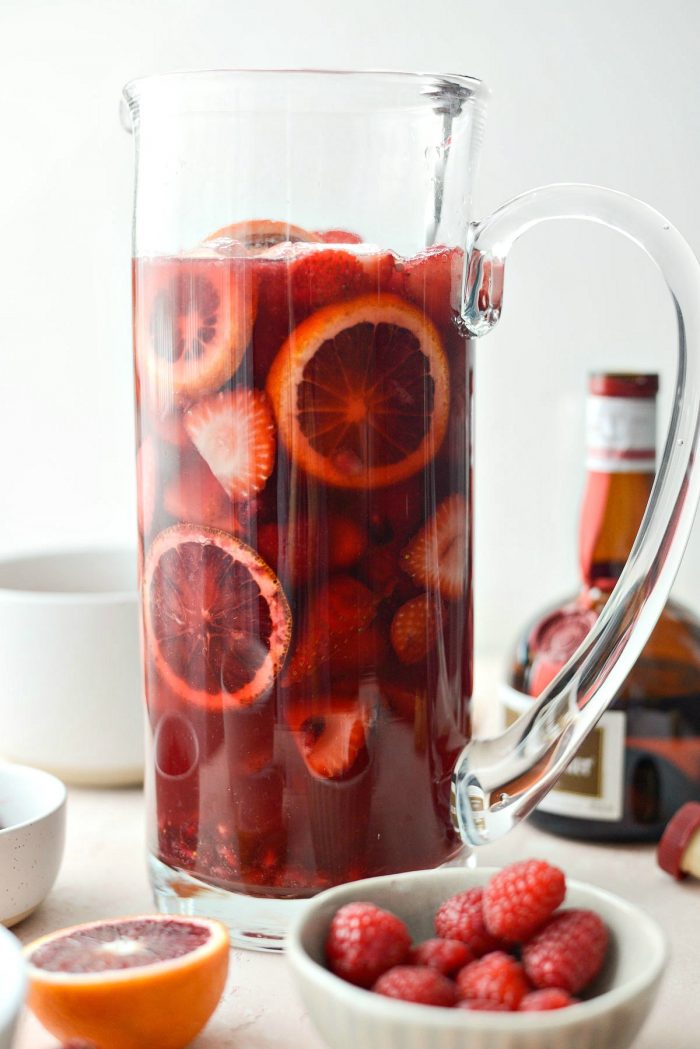 Champagne Sangria l SimplyScratch.com #champagne #sangria #valentinesday #adultbeverage #drink #alcholic #strawberry #pomegranate #raspberry #pitcherofsangria
