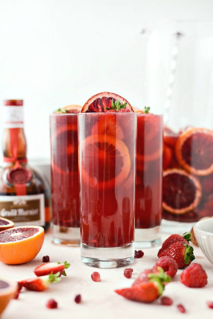 Champagne Sangria l SimplyScratch.com #champagne #sangria #valentinesday #adultbeverage #drink #alcholic #strawberry #pomegranate #raspberry #GalentinesDay