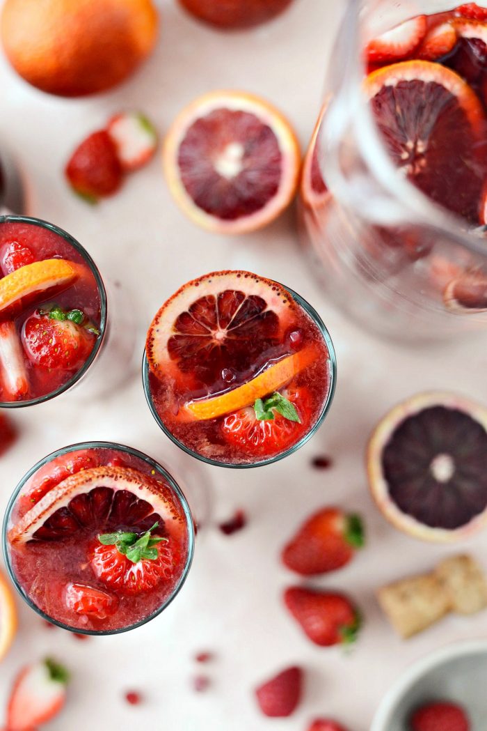 Champagne Sangria l SimplyScratch.com #champagne #sangria #valentinesday #adultbeverage #drink #alcholic #strawberry #pomegranate #raspberry