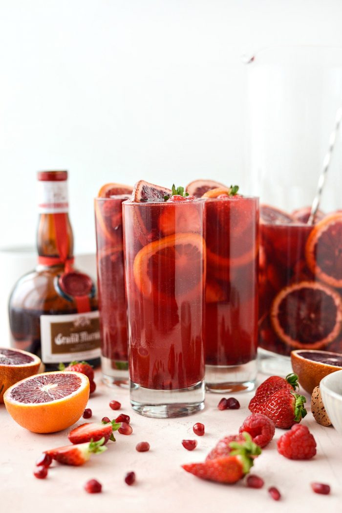 Champagne Sangria l SimplyScratch.com #champagne #sangria #valentinesday #adultbeverage #drink #alcholic #strawberry #pomegranate #raspberry