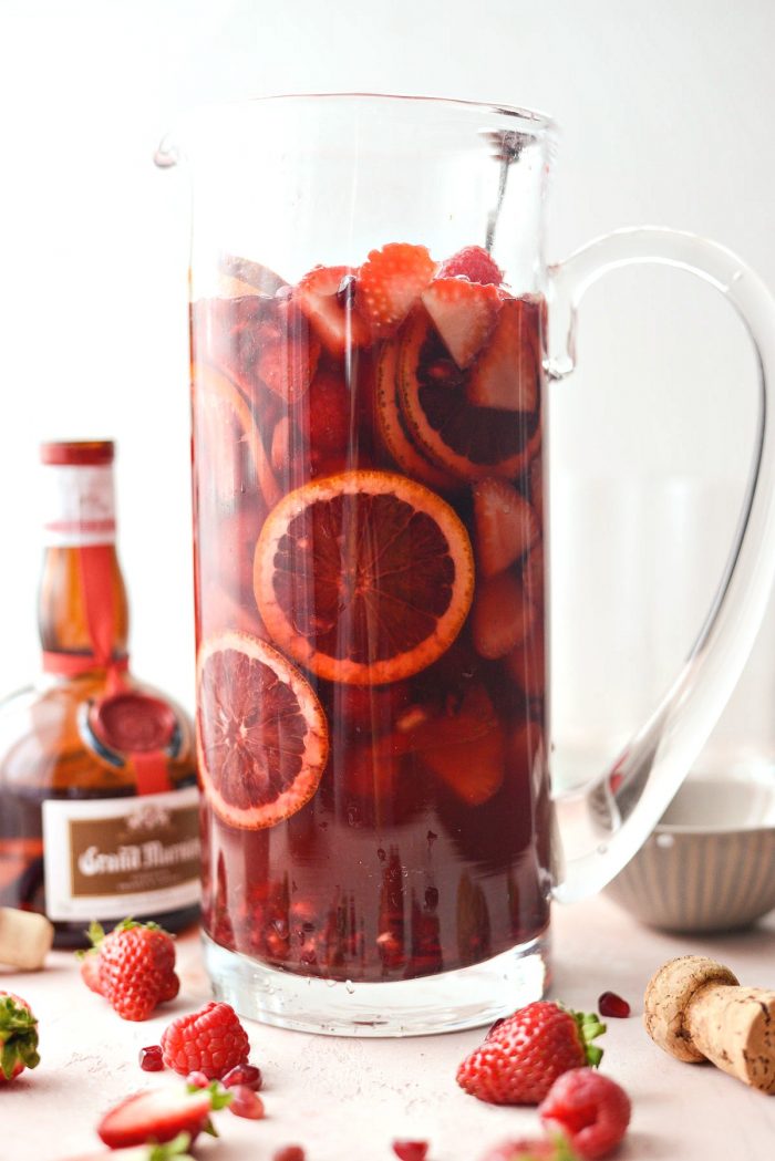 Champagne Sangria l SimplyScratch.com #champagne #sangria #valentinesday #adultbeverage #drink #alcholic #strawberry #pomegranate #raspberry