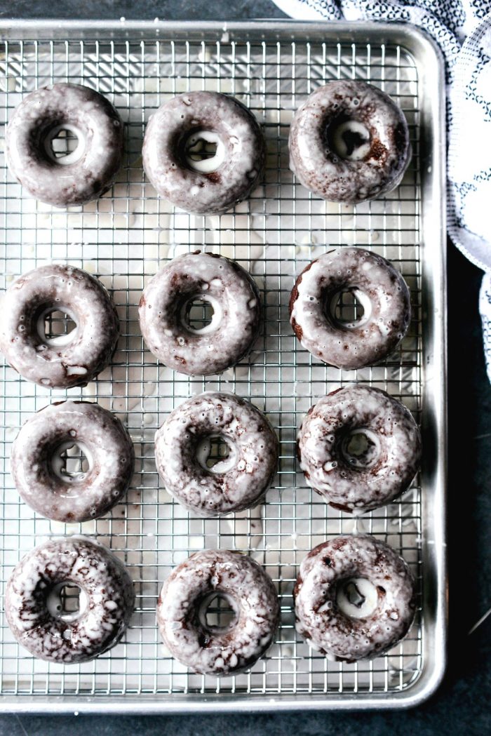 top down shot of 12 glazed doughnuts.