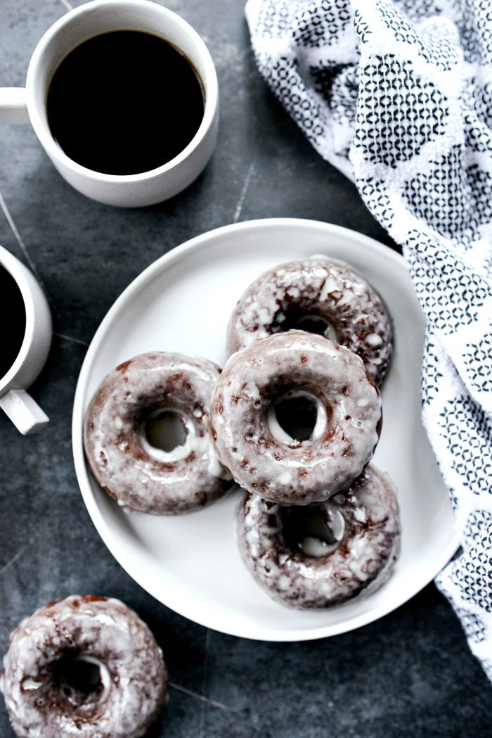 Glazed Chocolate Cake Doughnuts with 2 cups of coffee