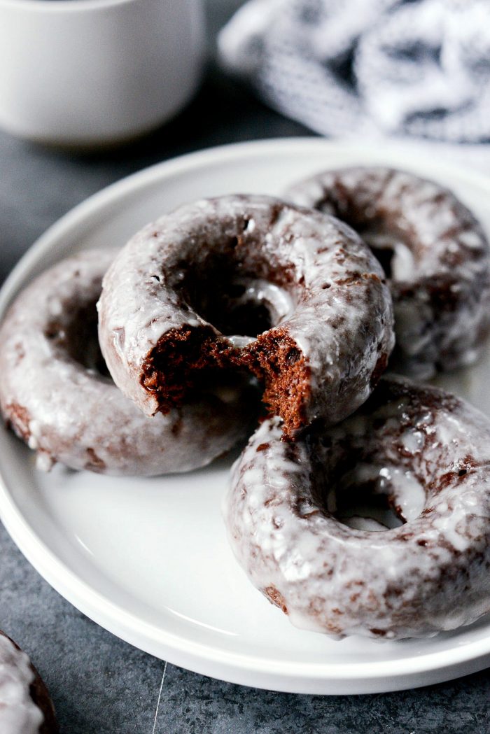 Glazed Chocolate Cake Doughnuts - close up of the doughnut missing a bite.