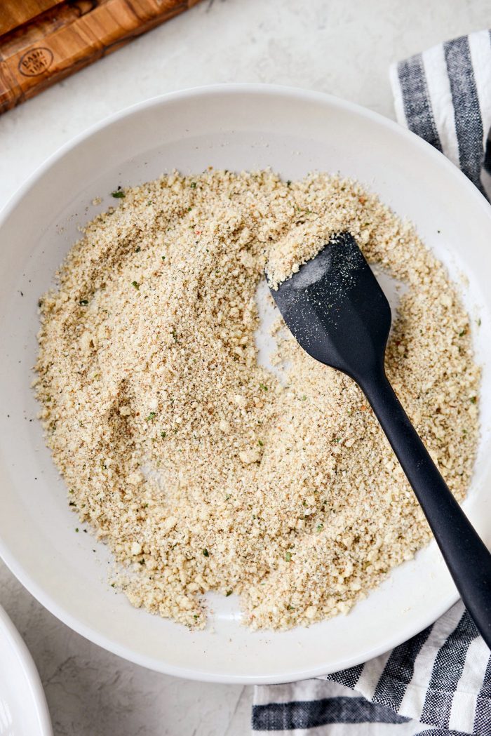 cream shallow bowl of breadcrumb mixture combined.