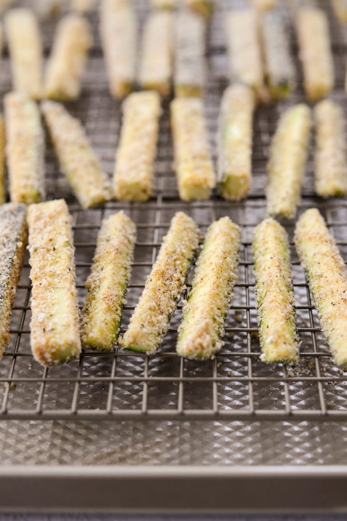coated zucchini fries on wire rack