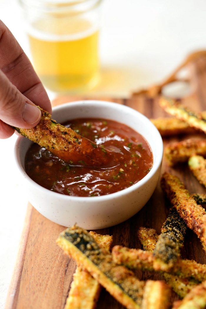 Air Fryer Zucchini Fries - close up of fry and basil ketchup.