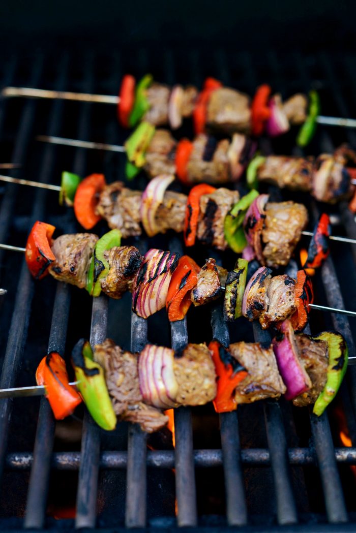 steak kebabs on grill with grill marks.