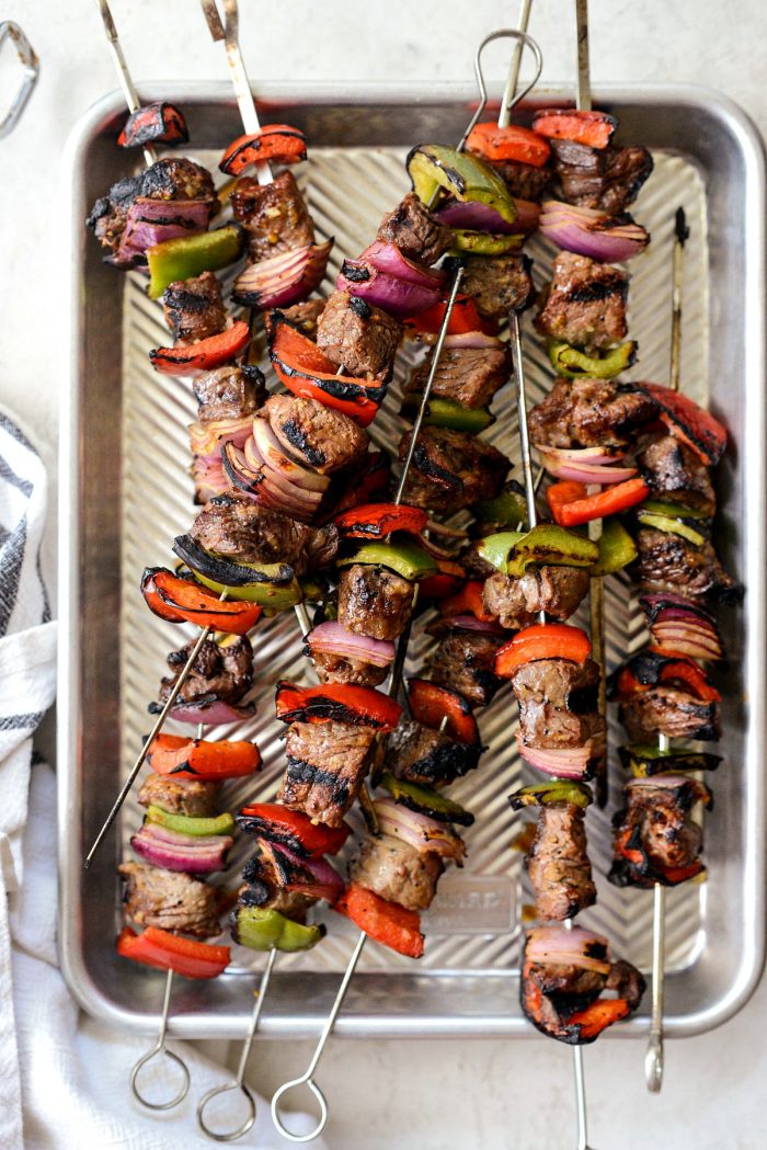 steak kebabs off of the grill and on metal pan.