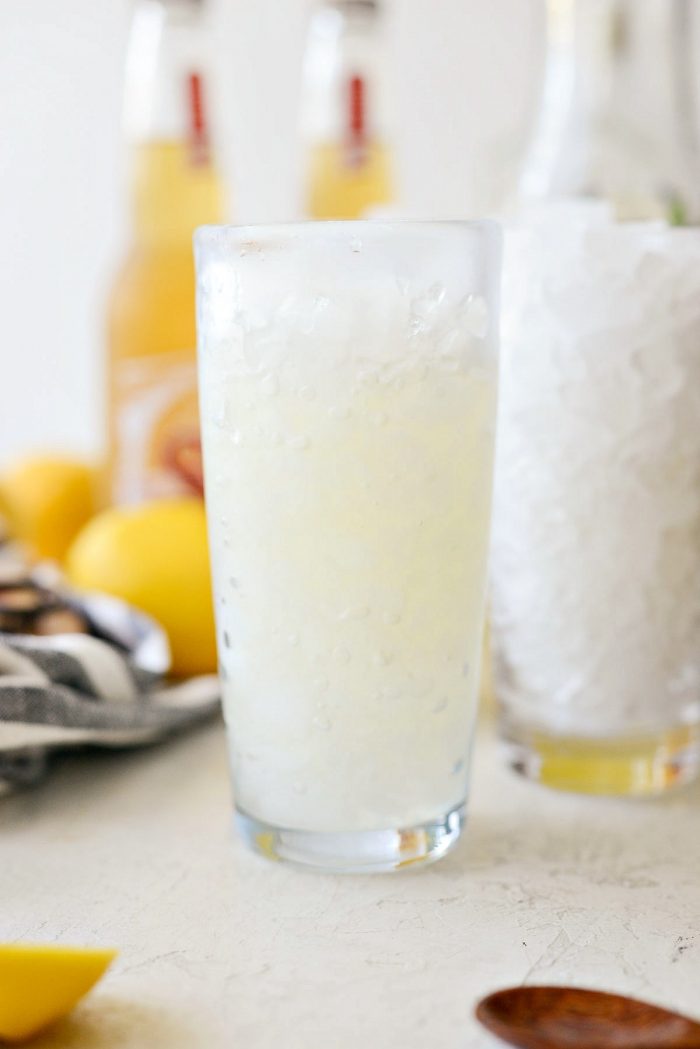 glass filled partly with sweetened lemon gin mixer