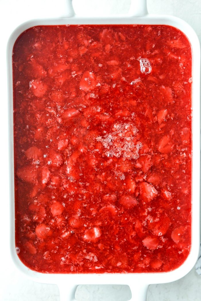 strawberry jell-o mixture poured over top of chilled cream cheese mixture.