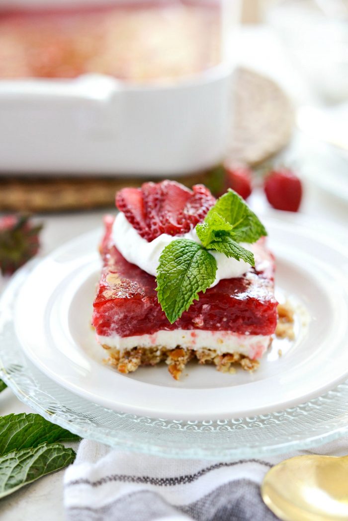 Front view of strawberry Pretzel Dessert Bars on white plate.