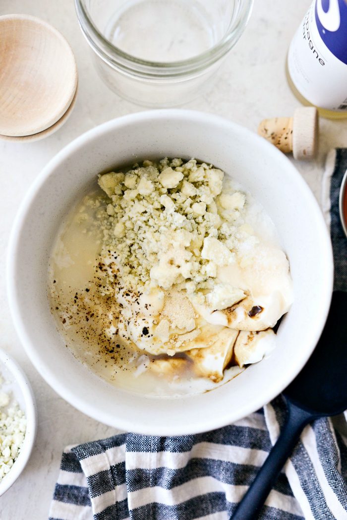 ingredients in white speckled bowl.