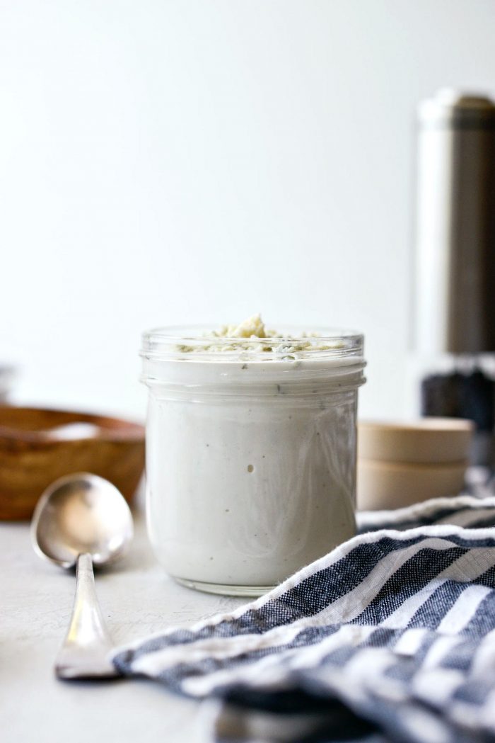 greek yogurt blue cheese salad dressing in glass jar.