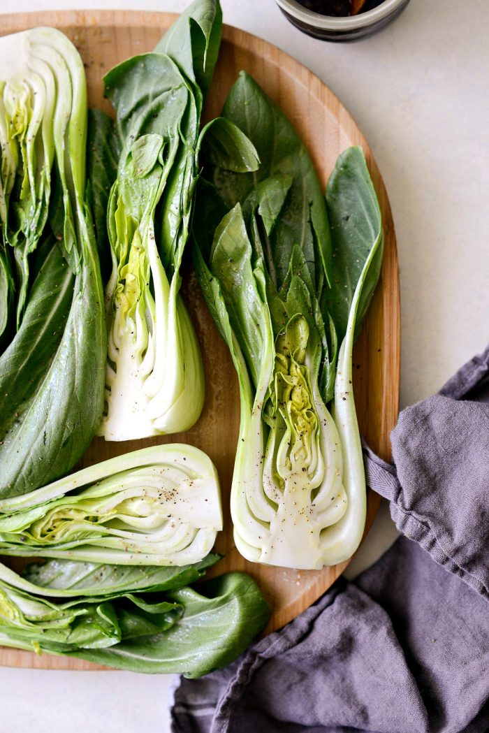 cut baby Bok Choy misted with olive oil and sprinkled with black pepper.