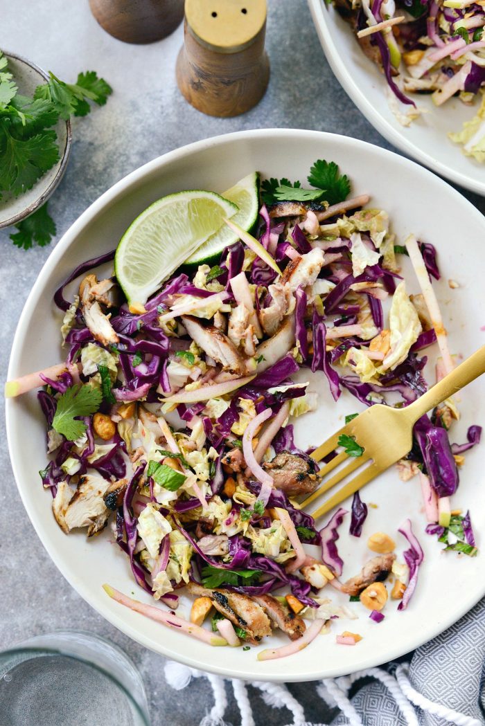 partially devoured bowl of Grilled Thai Chicken Salad.