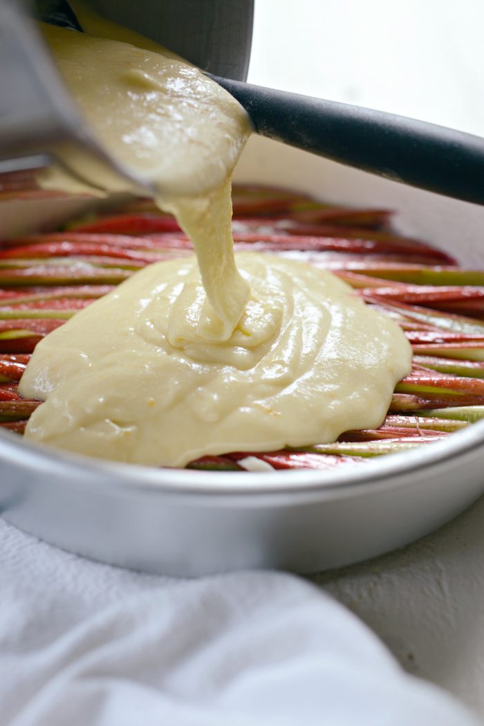 cake batter poured over rhubarb.