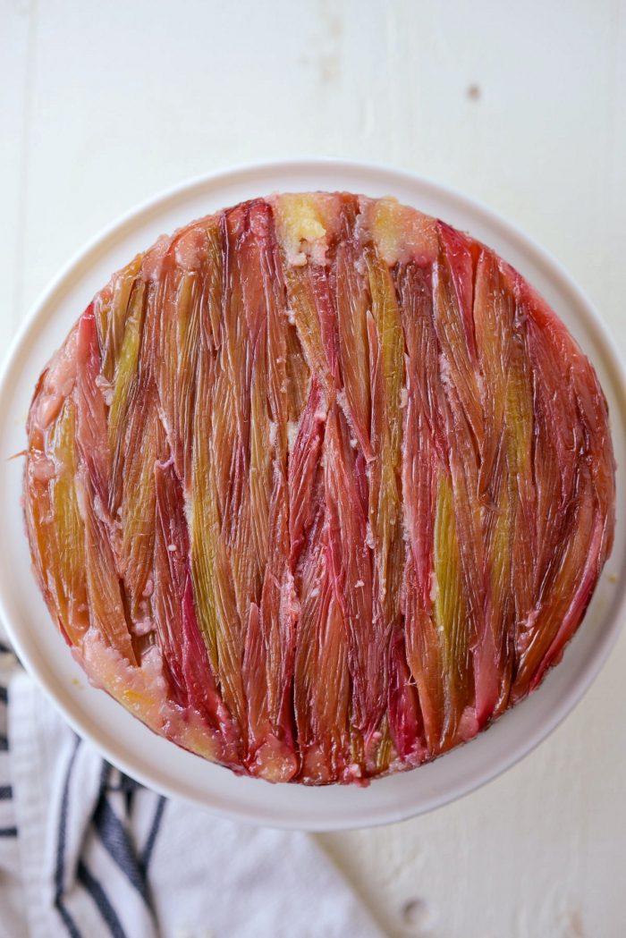 carefully invert Martha's Rhubarb Upside Down Cake onto stand and remove pan.