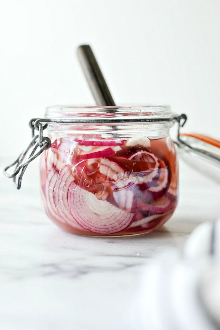 glass la parfait jar with quick pickled red onions.