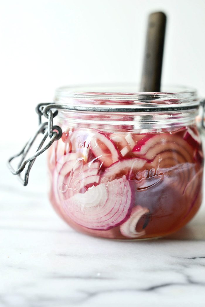 quick pickled red onions in jar.