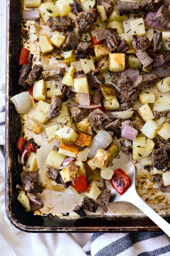 metal spatula serving the smoked brisket breakfast hash.