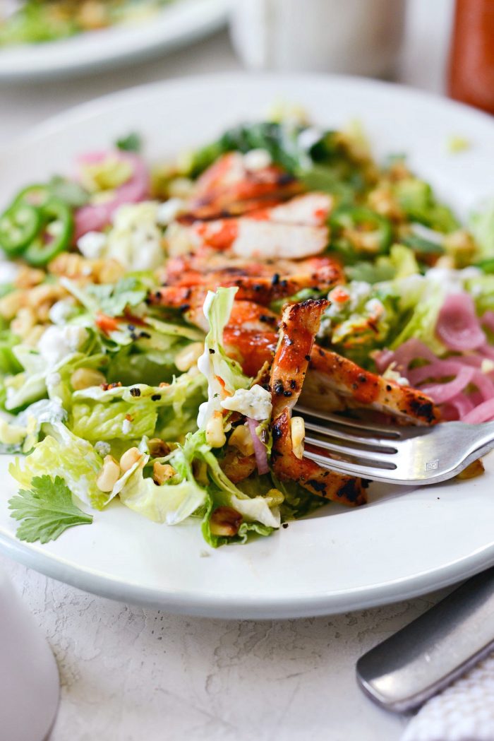 forkful of summer buffalo grilled chicken salad.