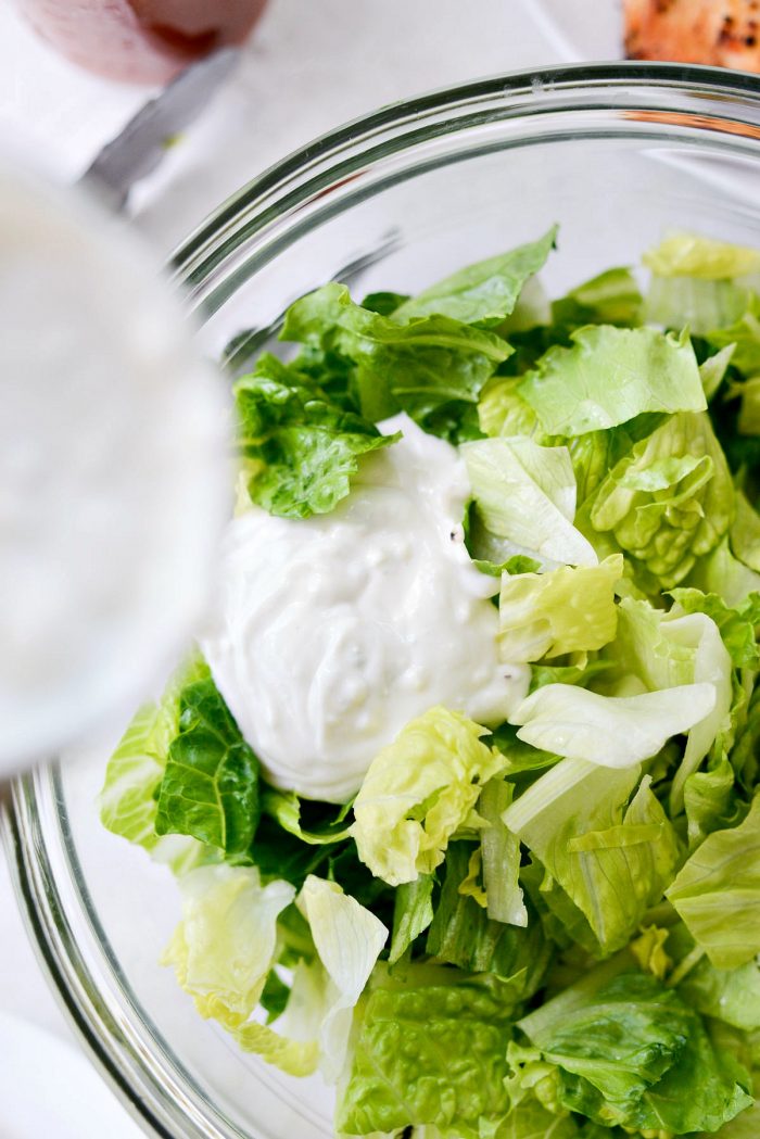 add some blue cheese dressing to salad greens.