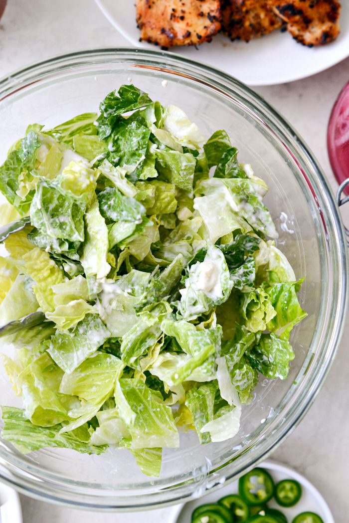 toss lettuces with salad dressing.