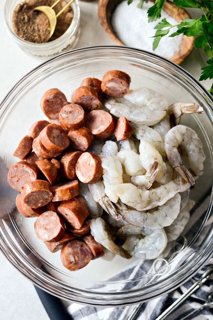 jumbo shrimp and sliced chicken andouille in glass bowl