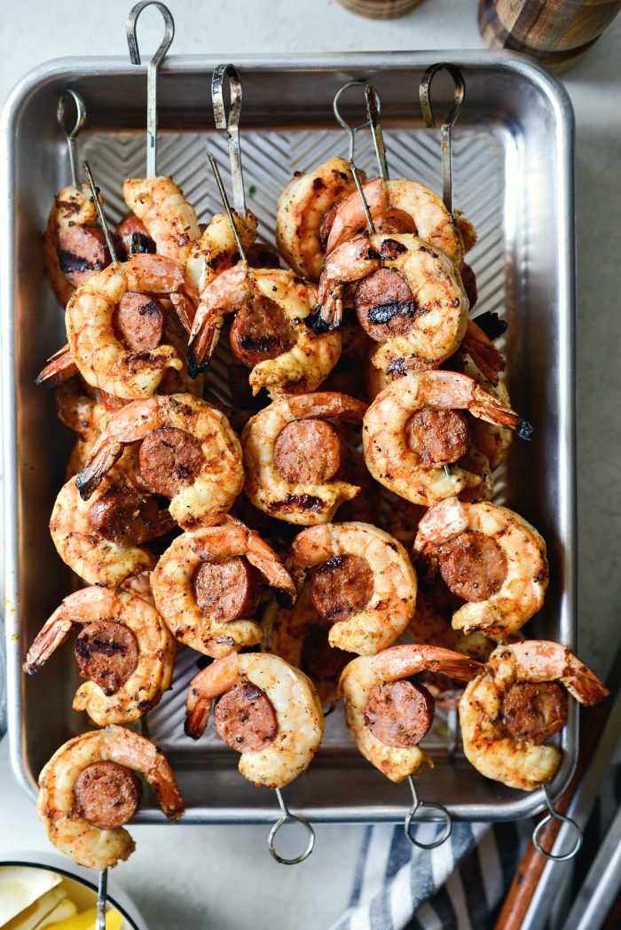 Cajun Shrimp and Andouille Skewers off of the grill and in metal pan