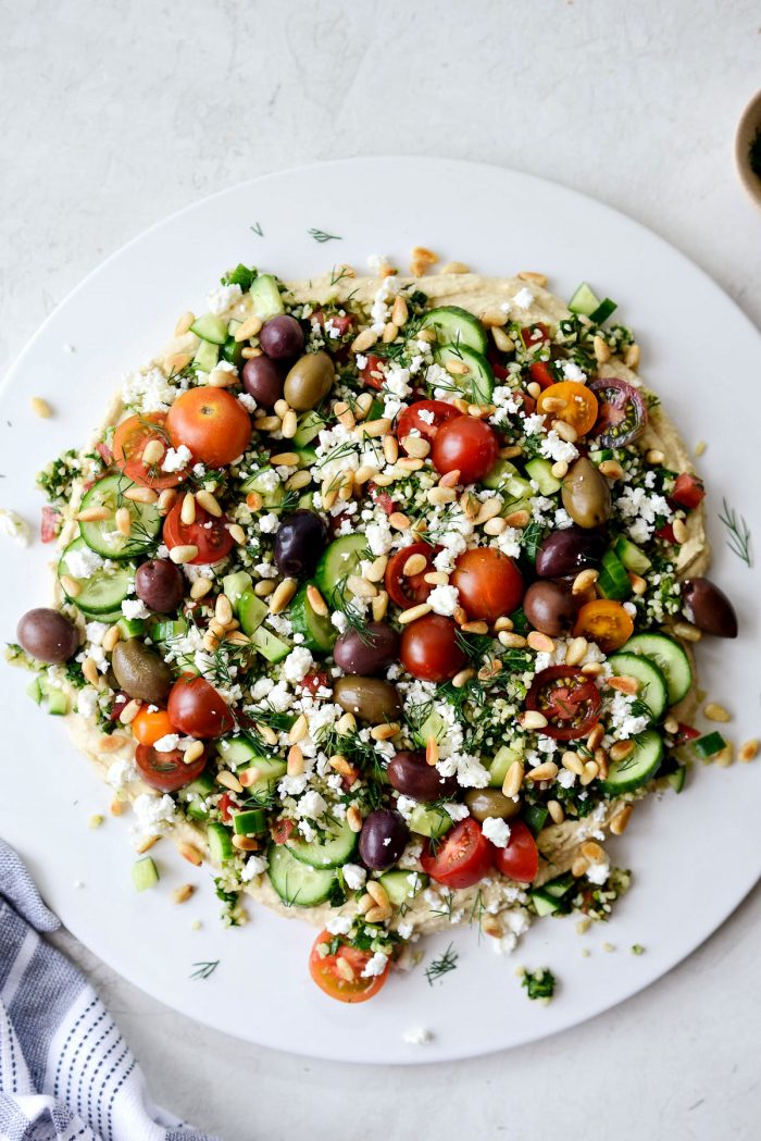 then topped with olives, tomatoes, feta and dill