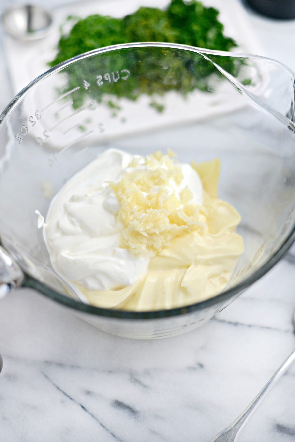 Add mayo, sour cream and garlic to a measuring cup