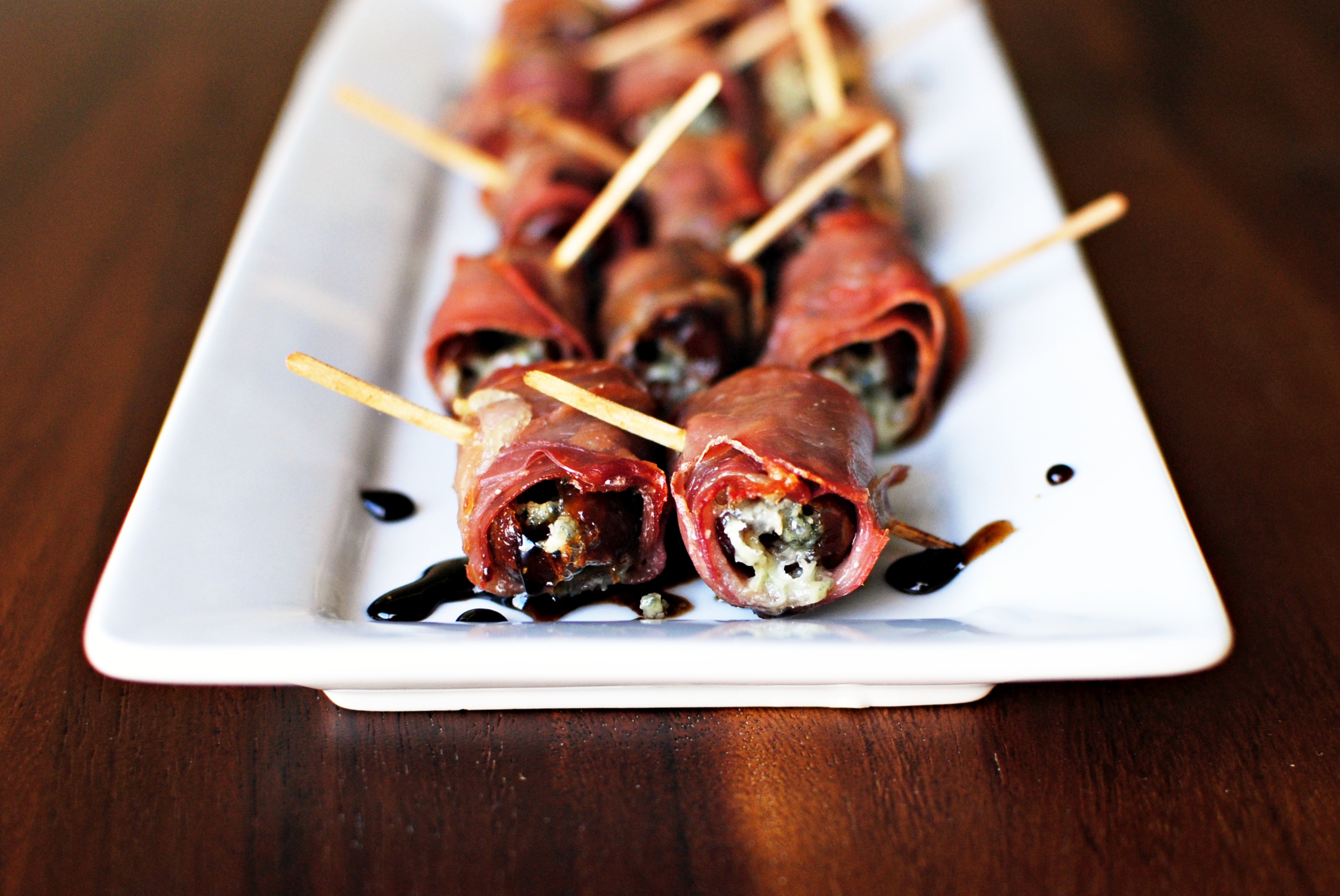 Prosciutto Wrapped Stuffed Dates with Honey Balsamic Drizzle