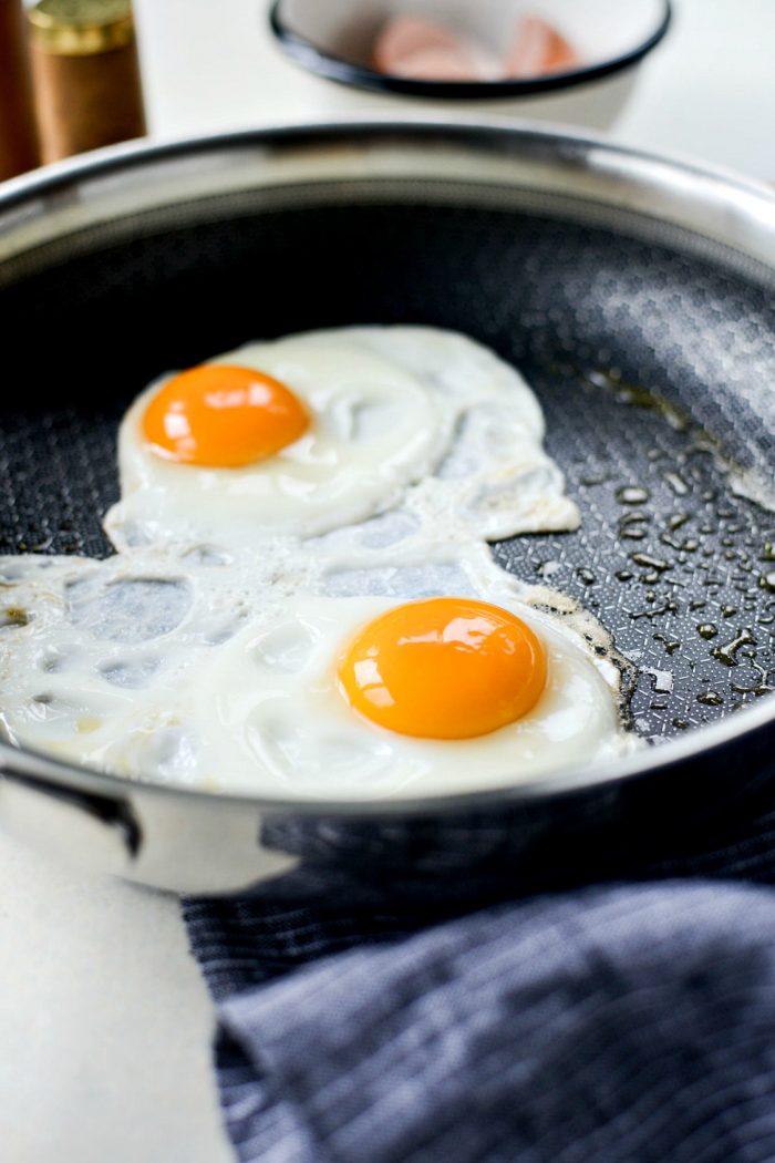 frying eggs in skillet