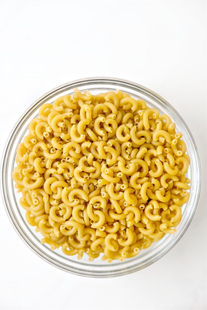 1 pound dried elbow macaroni in glass bowl