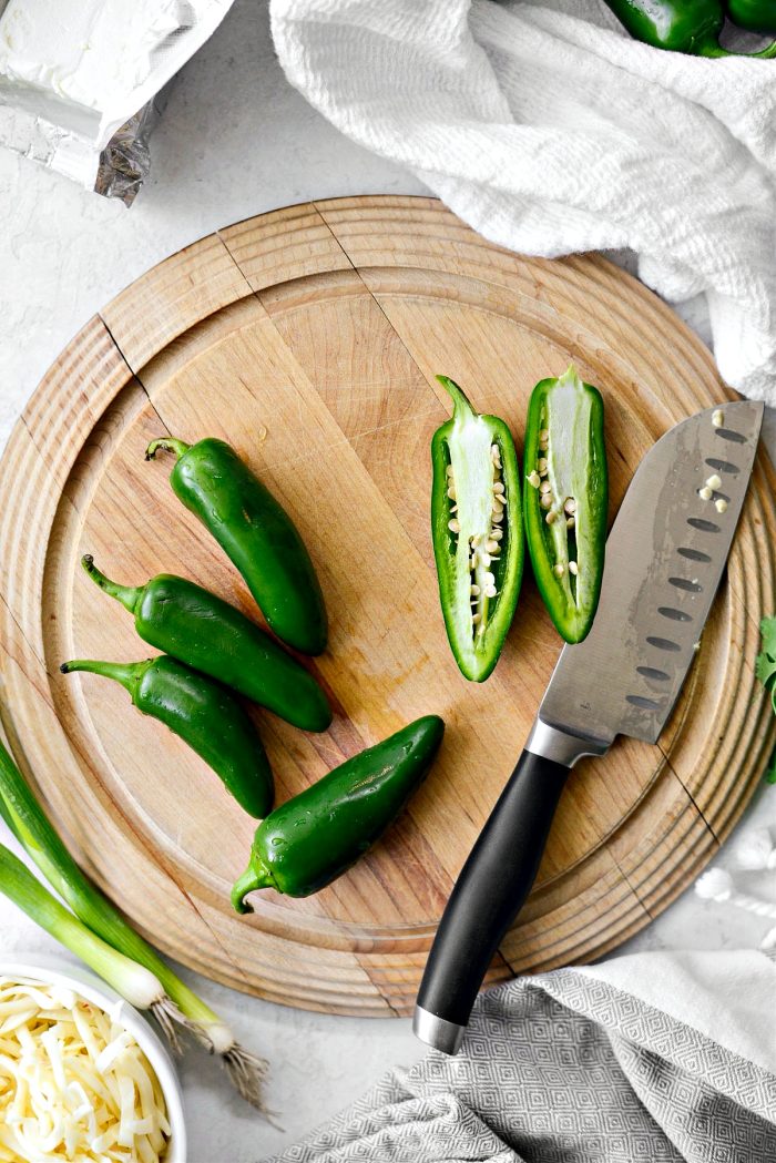 slice jalapeños in half lengthwise