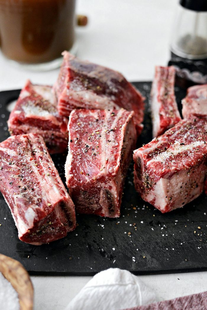 Season short ribs on all sides with salt and pepper
