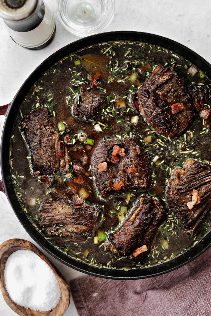 place short ribs back in pan