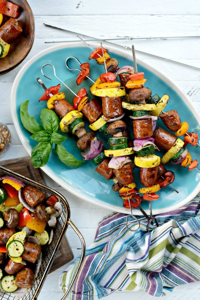 chicken sausage vegetable kebabs on turquoise platter